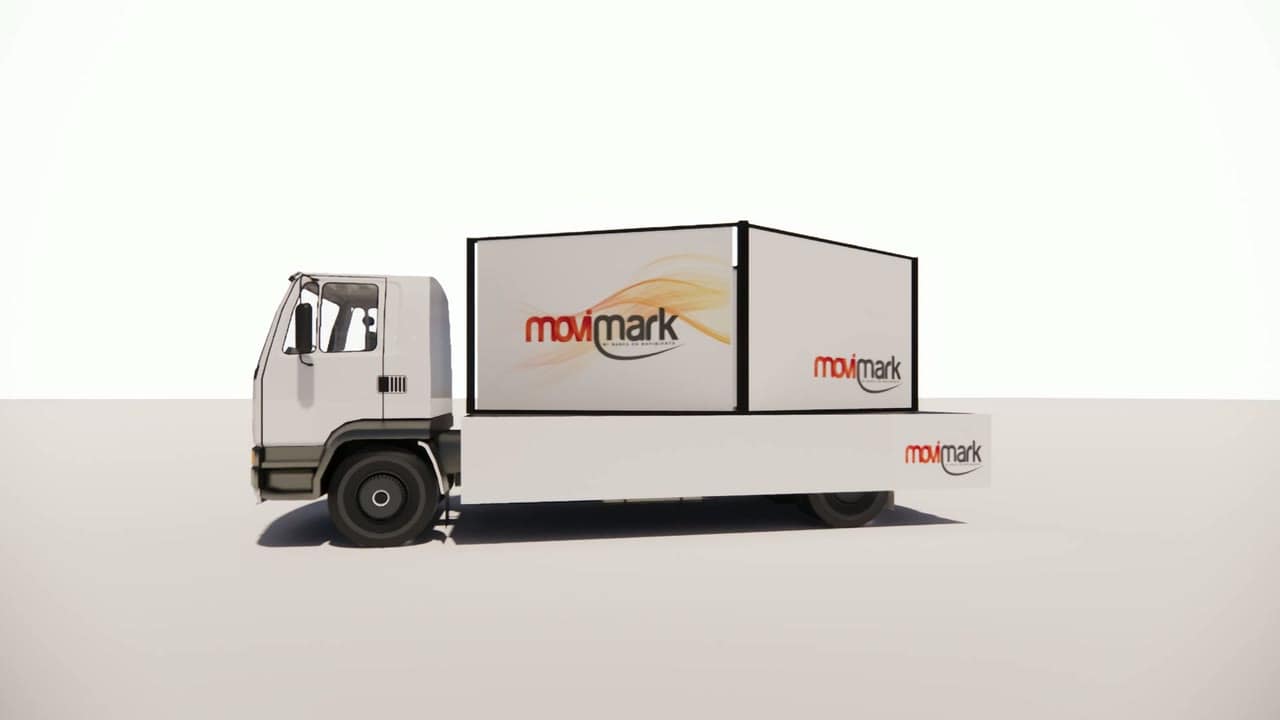 Camión carro valla de Movimark con vallas publicitarias a ambos lados